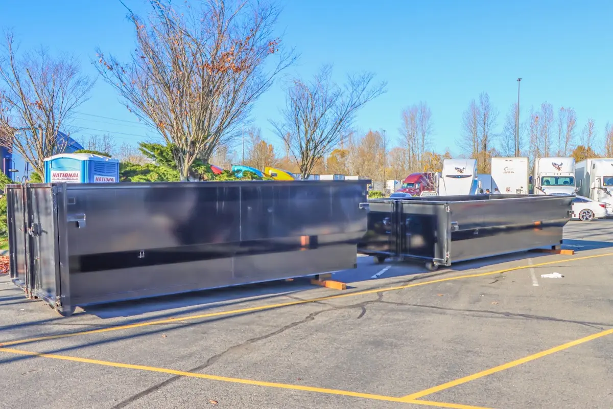 Professional dumpster rental service with roll-off container on residential driveway in Granite Bay